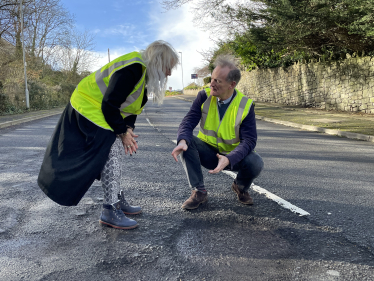 John discusses potholes with local Councillor